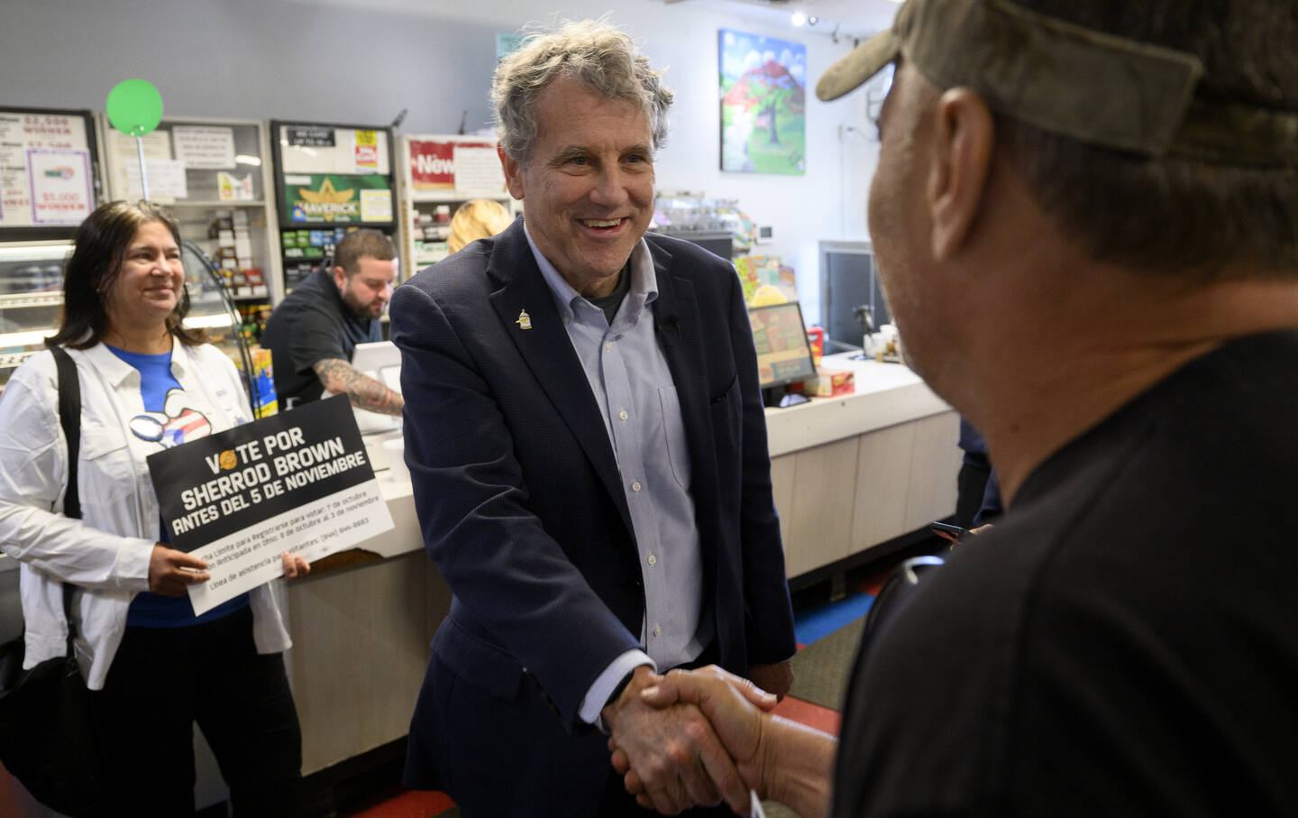 US Senator Sherrod Brown (D-OH) talks with voters during a campaign stop at Rainbow Bakery, a Puerto Rican–owned and –operated grocery store in Lorain, Ohio, on October 30, 2024.