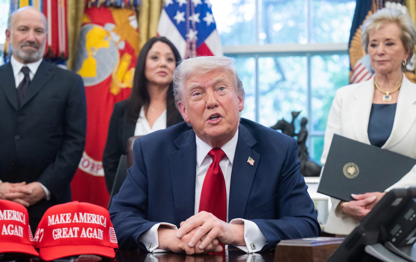 Donald Trump speaks to the media after signing executive orders relating to higher education.